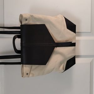 Beige black backpack type bag